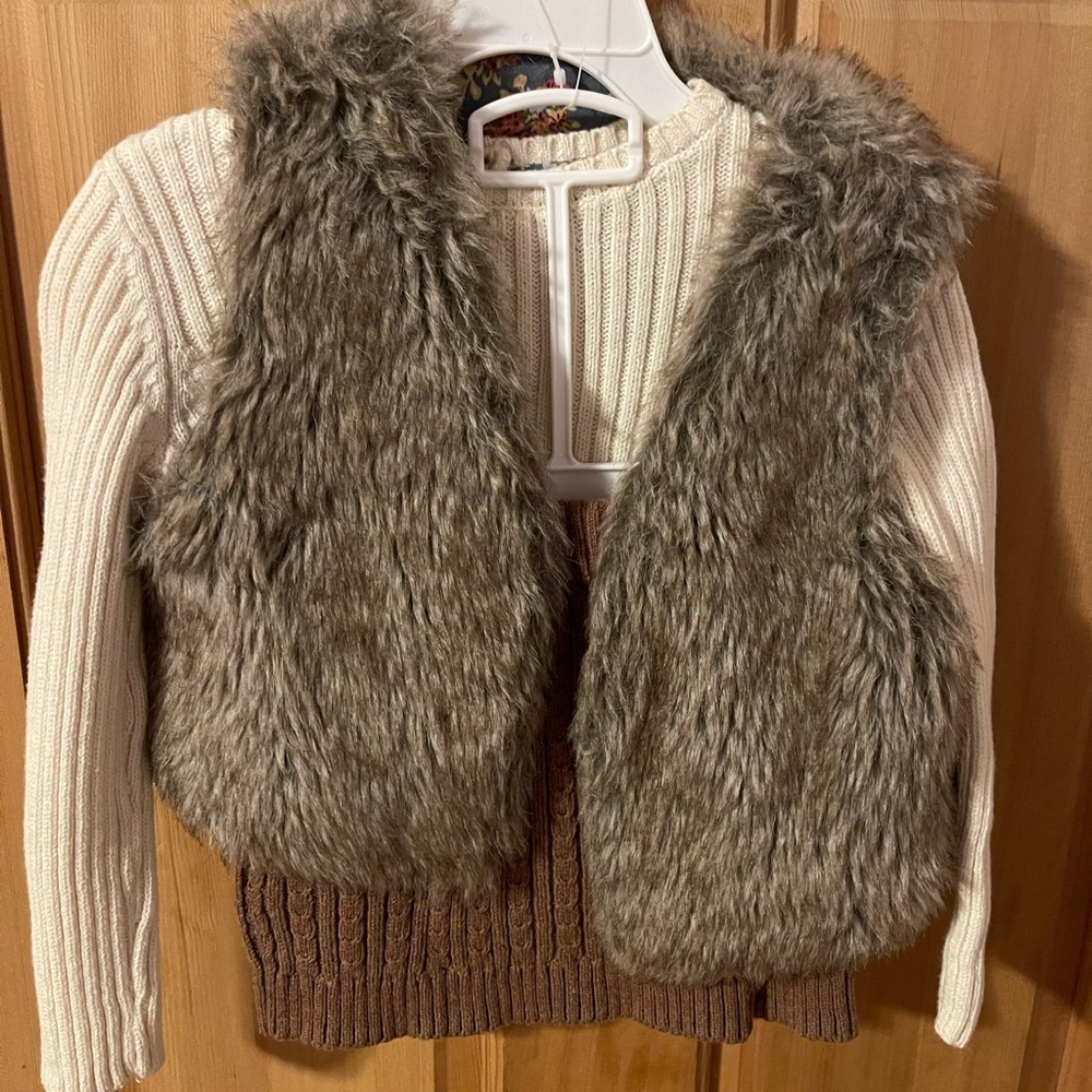 Cute skirt, long sleeve, and fuzzy vest outfit